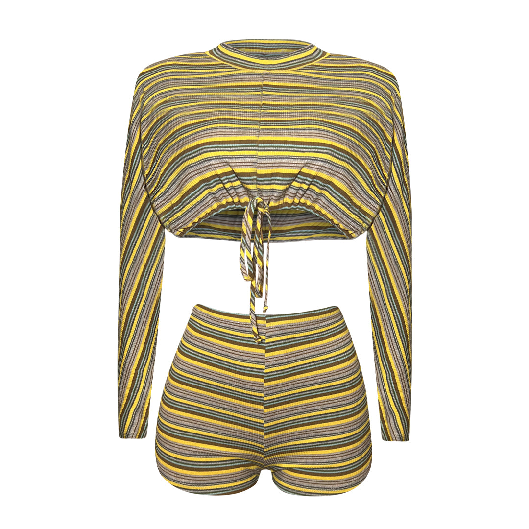Mustard multi-stripe ribbed two-piece shorts set featuring a long sleeve crop top with front cutout tie detail and high-waist fitted shorts.