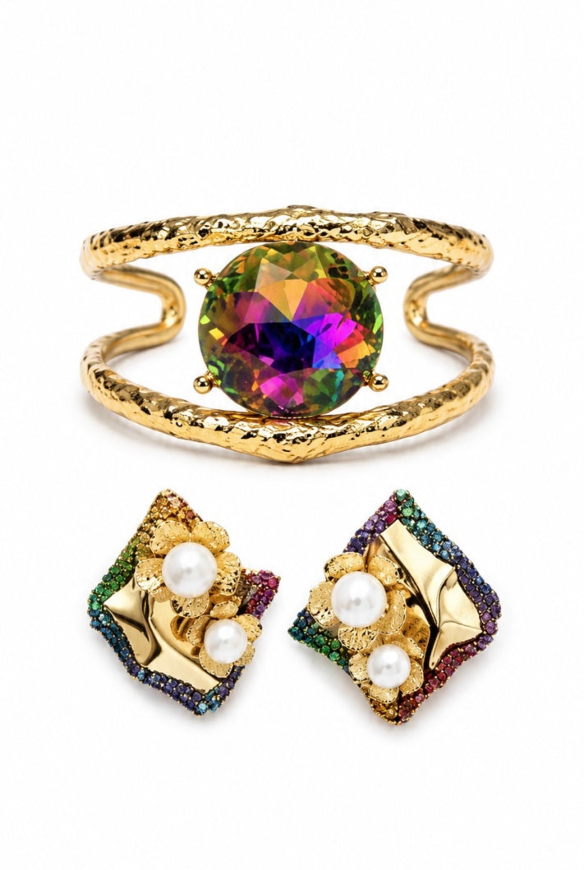 Gold jewelry set featuring an open cuff bracelet with a multicolor prism crystal and matching floral stud earrings with faux pearls and multicolor crystal accents.