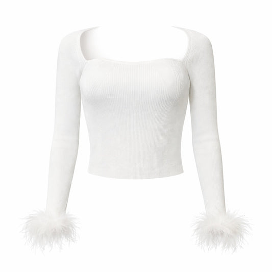 White ribbed long sleeve crop top with square neckline and feather cuff sleeves. 