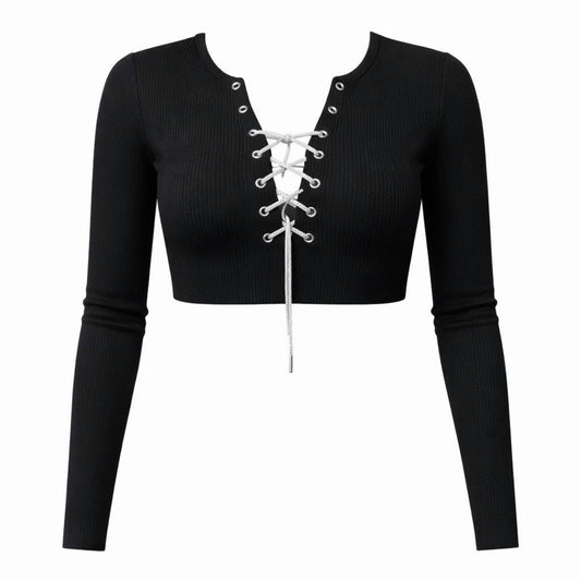 Black ribbed long sleeve crop top with rhinestone lace-up front detail and fitted stretch design, front view.