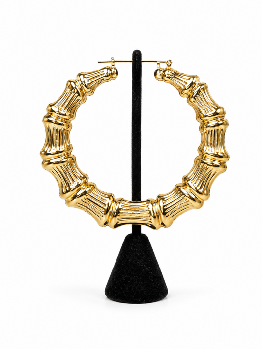 Gold round bamboo hoop earrings with textured ribbed detailing and polished high-shine finish**
