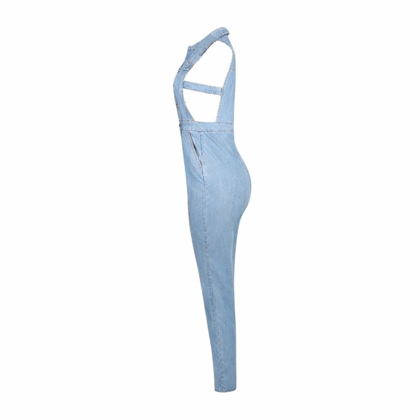 Medium wash sleeveless denim jumpsuit with side cut out detail, button down front, fitted waist, and skinny leg stretch denim silhouette side view.